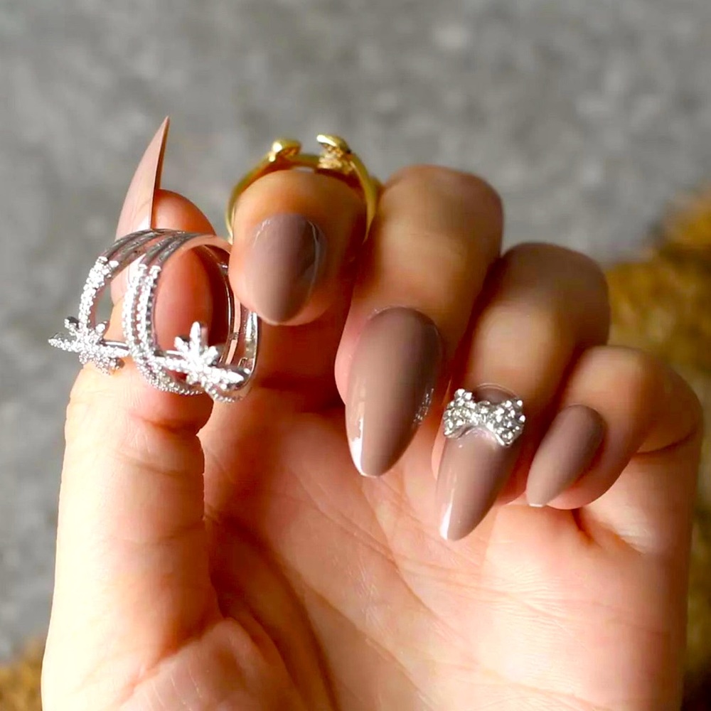 Nude Negligee Press on nails with two bow tie rhinestone accent nails